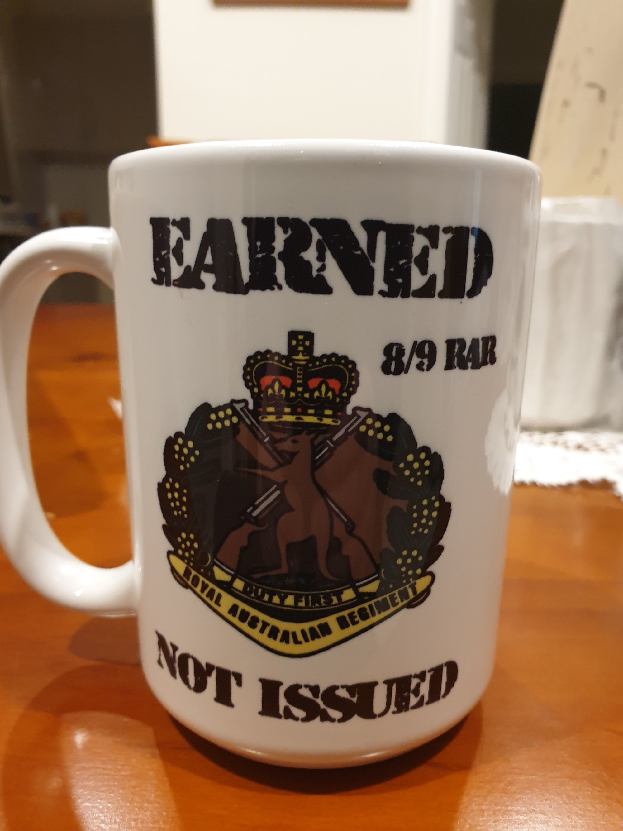 15 OZ  8/9 Earned not issued mug