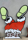 Santa upside down in chimney